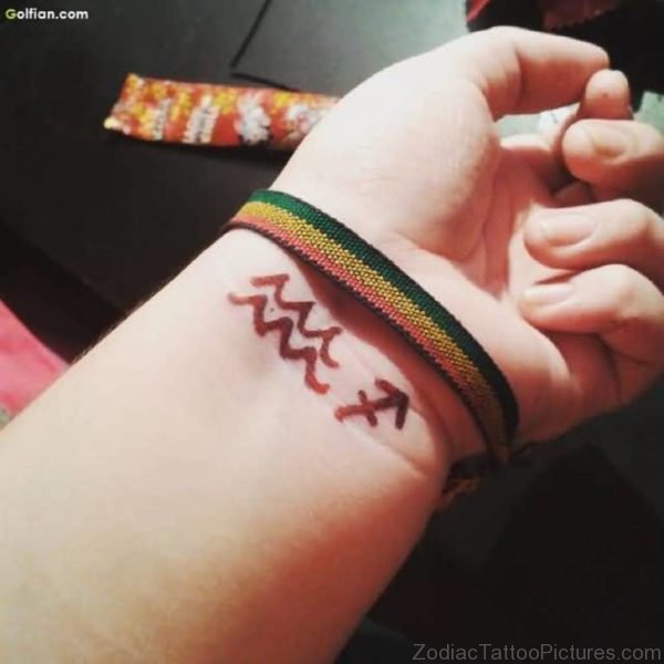 Aquarius Zodiac Symbol Tattoo On Wrist 