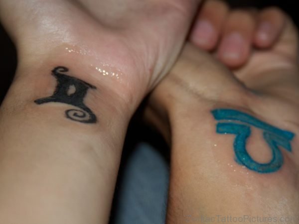 Gemini And Blue Ink Libra Zodiac Tattoo On Wrists 