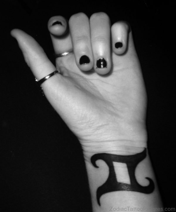 Girl With Dark Black Gemini Tattoo Zodiac On Wrist