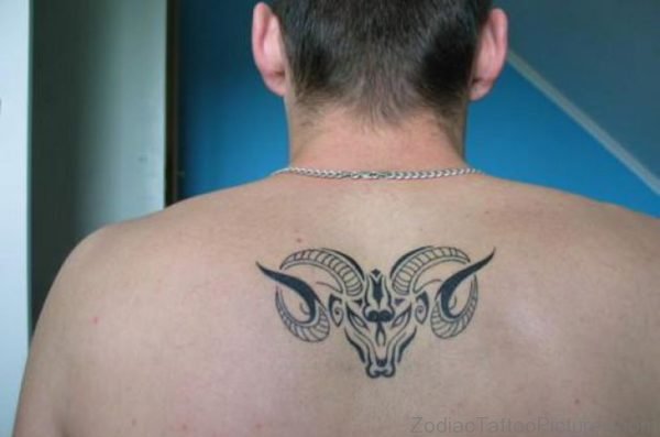 Aries Tattoo On Mans Upper Back
