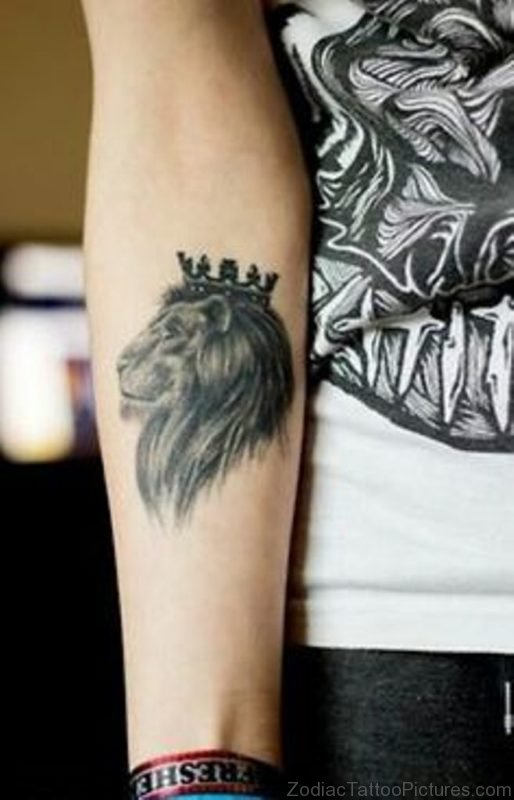 Black And Grey Crown On Leo Head Tattoo On Forearm