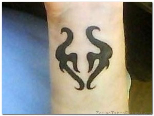 Black Colored Taurus Zodiac Tattoo On Leg