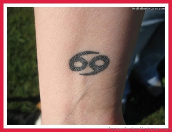Black Ink Cancer zodiac Sign Tattoo On Wrist