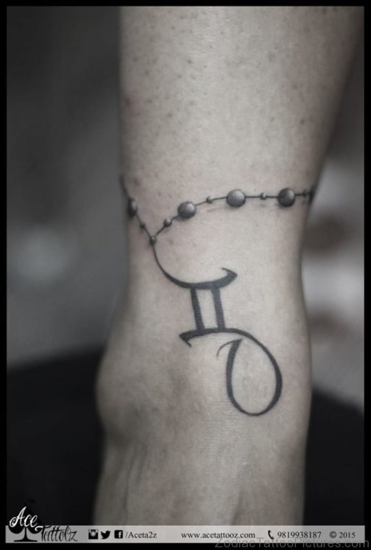 Black Ink Rosary Gemini Zodiac Sign Tattoo On Ankle