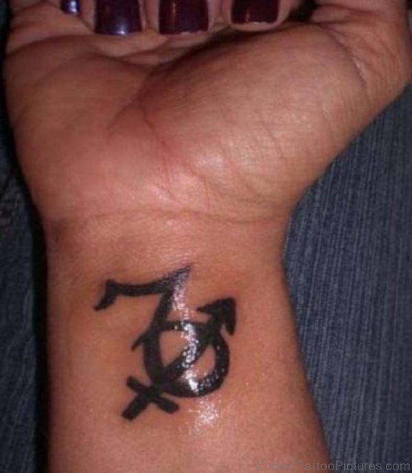 Black Ink Sagittarius And Capricorn Tattoo On Wrist 
