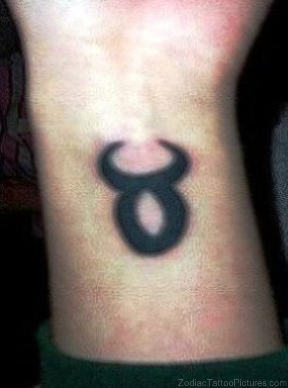 Black Ink Taurus Tattoo On Wrist