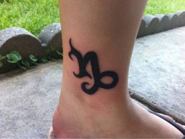 Black Ink Tribal Capricorn Zodiac Tattoo On Ankle