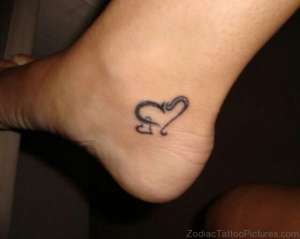 Black Leo Heart Symbol Tattoo On Ankle
