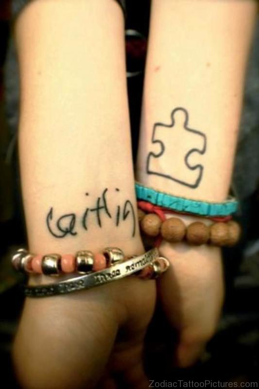 Black Outline Autism Tattoo On Wrist