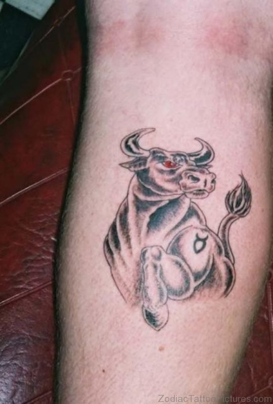 Cool red eyed black ink Taurus tattoo on leg