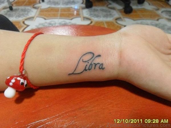 Cute Libra Zodiac Sun Sign Tattoo On Girl Left Wrist