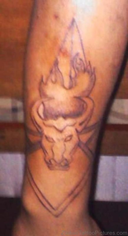 Flaming Taurus Bull Tattoo On Leg