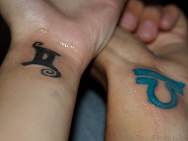 Gemini And Blue Ink Libra Zodiac Tattoos On Wrists