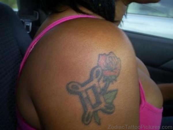 Girl With Gemini Tattoo Zodiac With Flowers On Shoulder