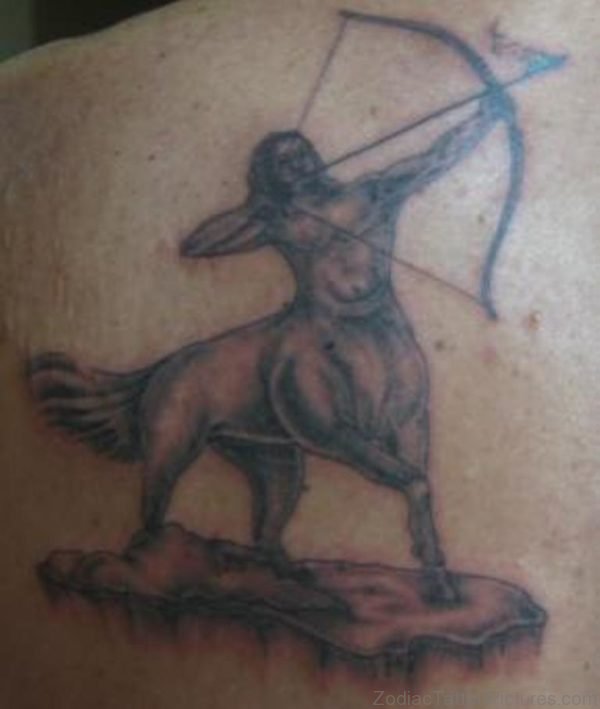 Grey Ink Sagittarius Tattoo On Back Shoulder 