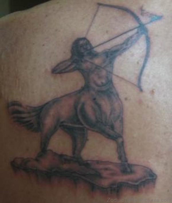 Grey Ink Sagittarius Tattoo On Back Shoulder