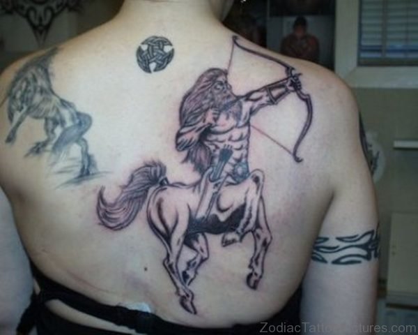 Grey Ink Sagittarius Tattoo On Girl Upper Back 