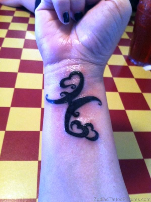 Large Black Pisces Symbol Wrist Tattoo 