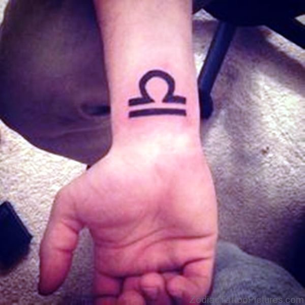 Large Libra Tattoo On Wrist 