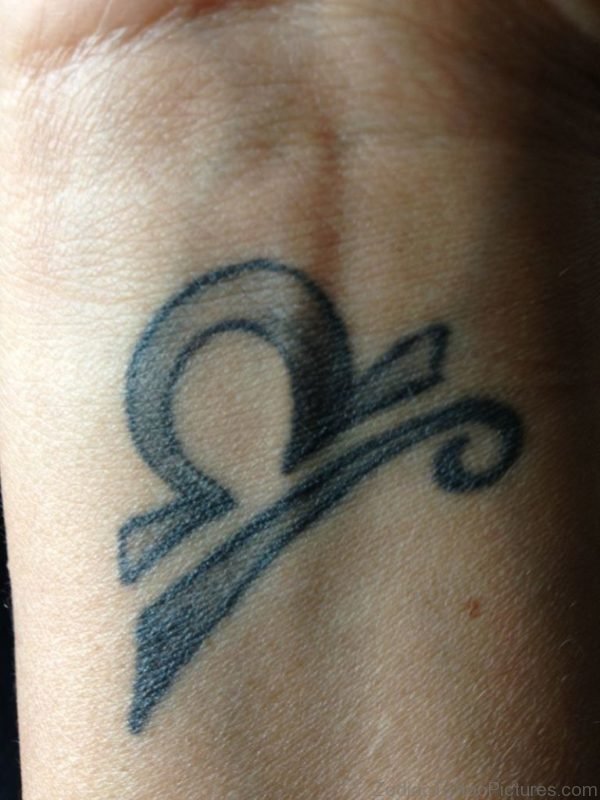 Libra Symbol Tattoo On Wrist