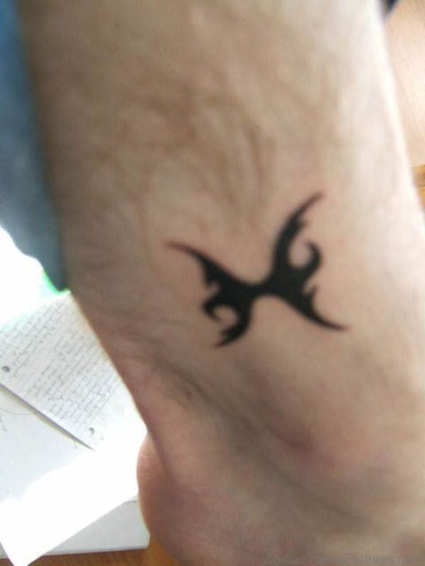 Man With Black Pisces Zodiac Tattoo On Ankle