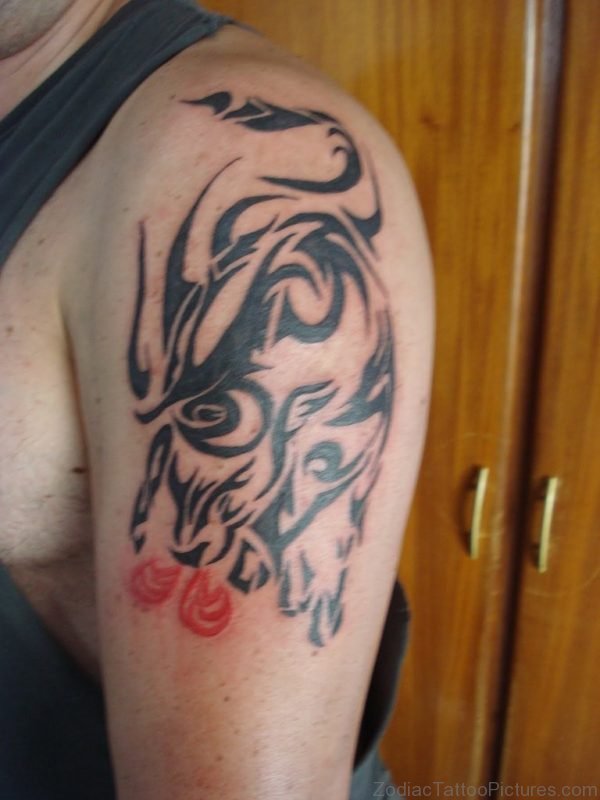 Man With Tribal Black Taurus Tattoo