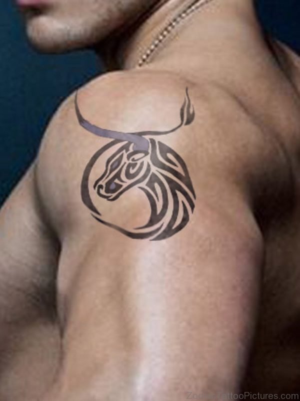 Man With Tribal Bull Taurus Tattoo On Shoulder