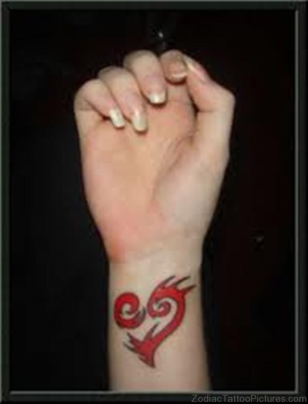 Red Ink Cancer Tattoo On Wrist
