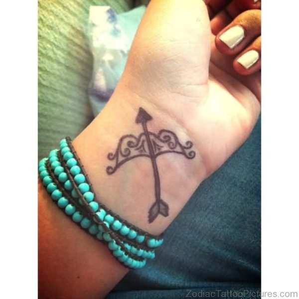 Sagittarius Bow And Arrow Tattoo On Wrist 