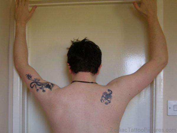 Small Scorpion Tattoo On Right Back