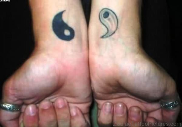 Stunning Yin Yang Tattoo On Wrist 