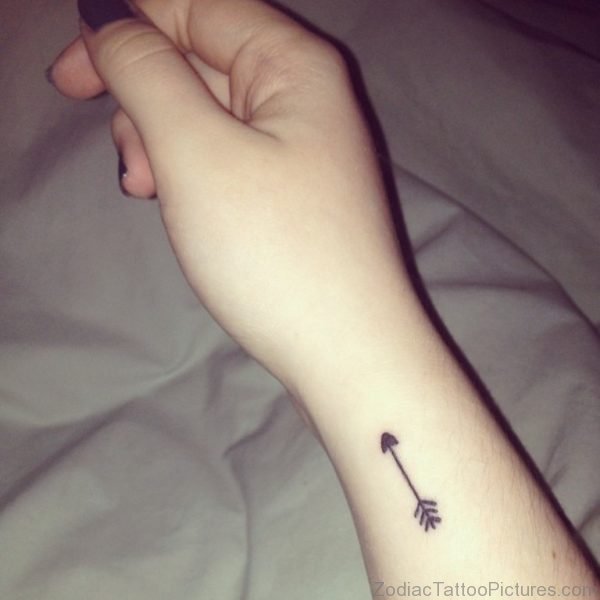 Tiny Black Arrow Tattoo On Wrist