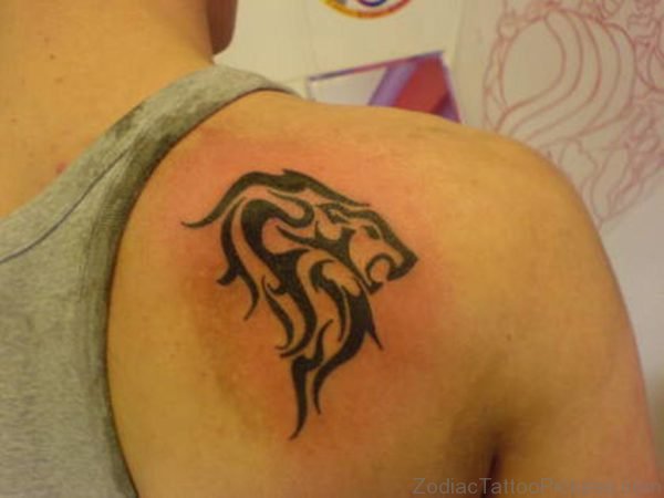 Tribal And Taurus Tattoos On Right Back Should