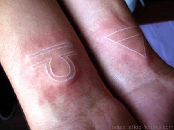 White Libra Tattoo On Wrist 