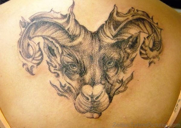 Women Show Aries Back Tattoo